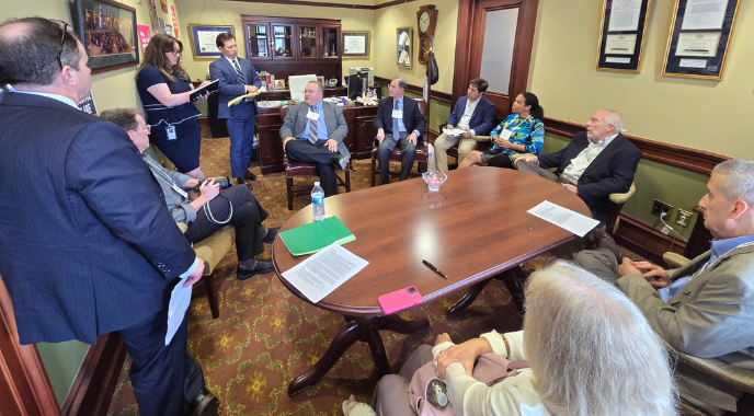 Volunteer advocates meet with elected officials and their staffers.